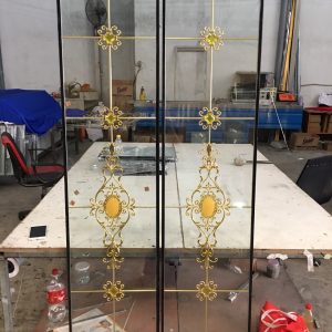 Thi công cửa đi Savio hệ 65 kết hợp kính hộp nan đồng tại Bình Dương